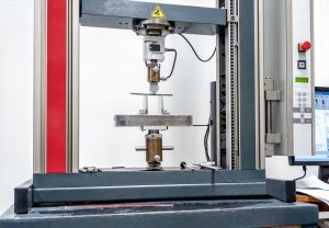 Aging universal testing machine with a PC-control panel — a retrofit candidate